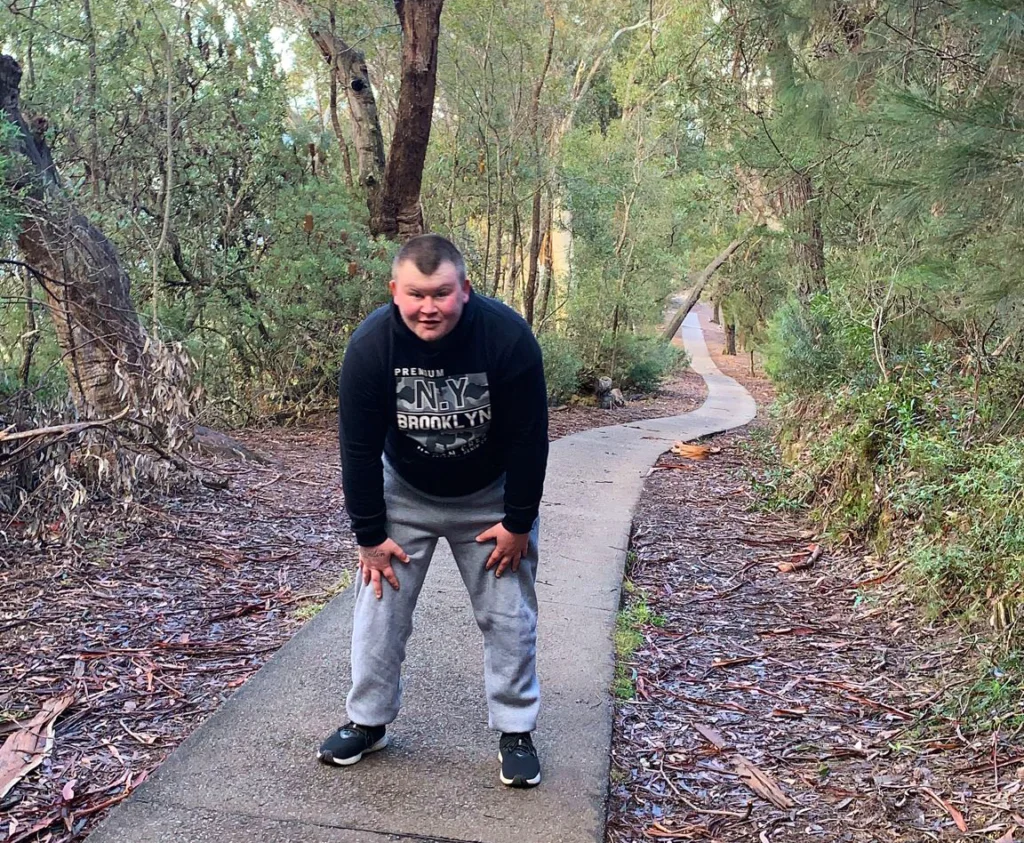 A client walking on a nature trail